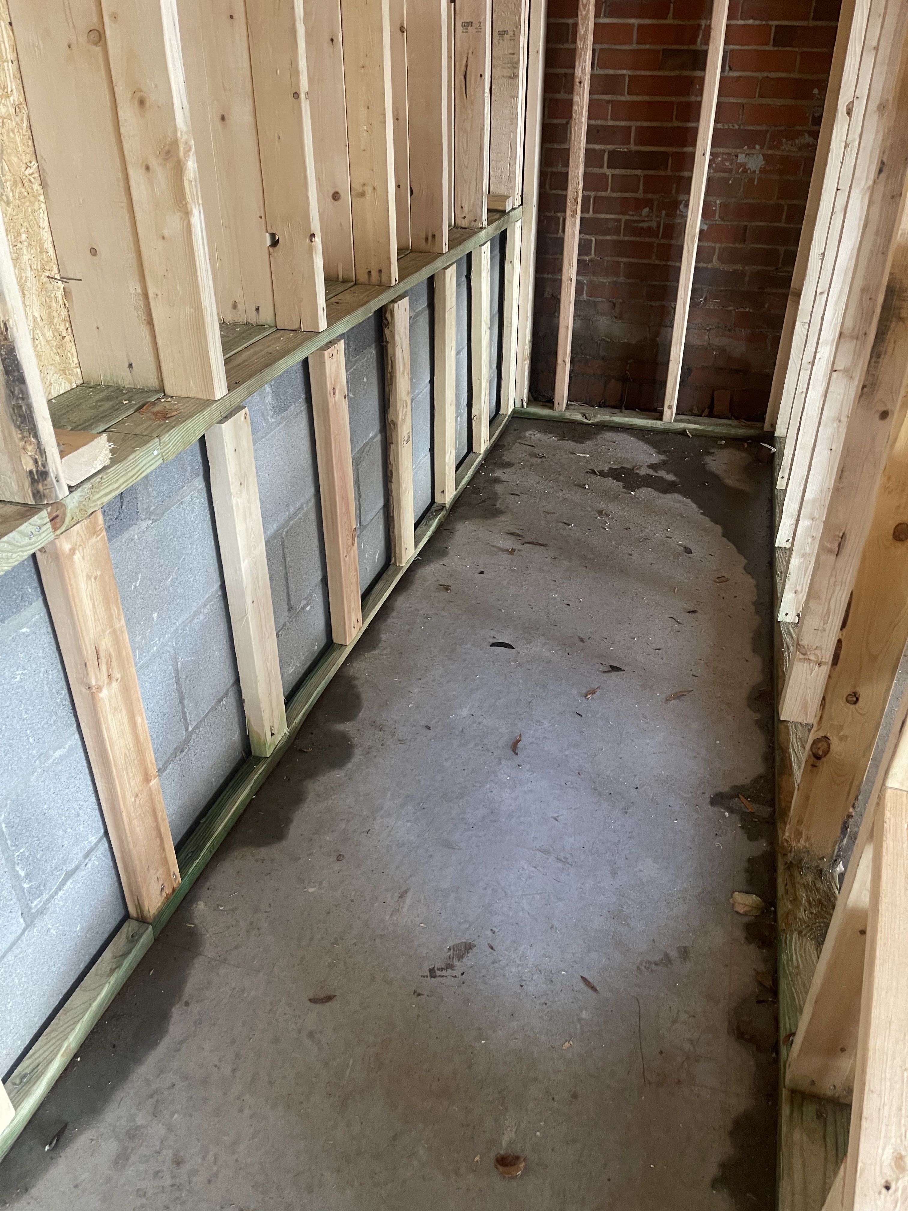 Crawlspace encapsulation in progress — access hatch